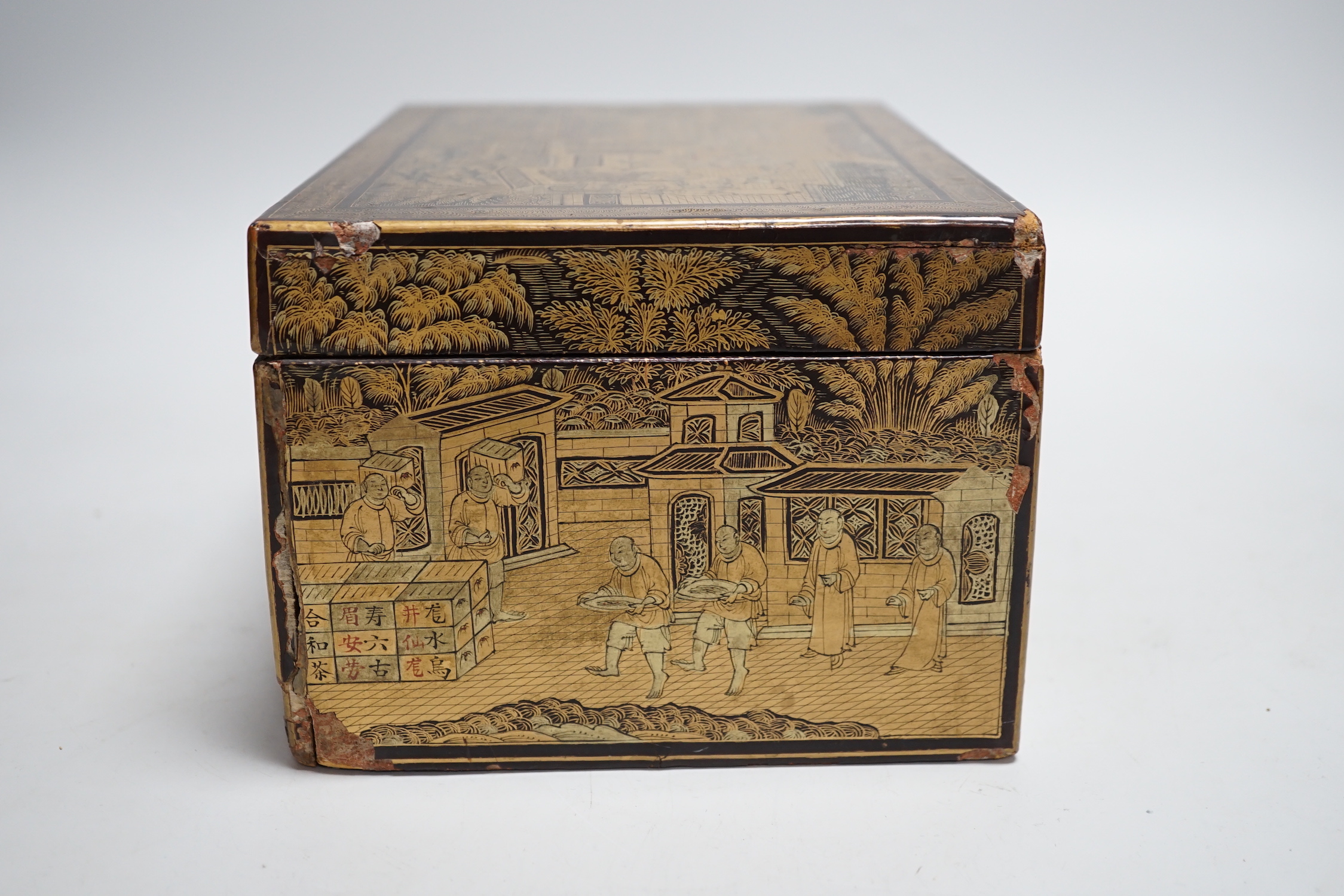 A 19th century Chinese export lacquer tea caddy, black ground with gilt decoration, containing a separate lidded pewter lining box with engraved decoration, 23cm x 16cm x 12cm